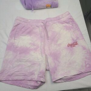 2 X 1 pair of H&M tie-dye purple and white cloth shorts. Size M
